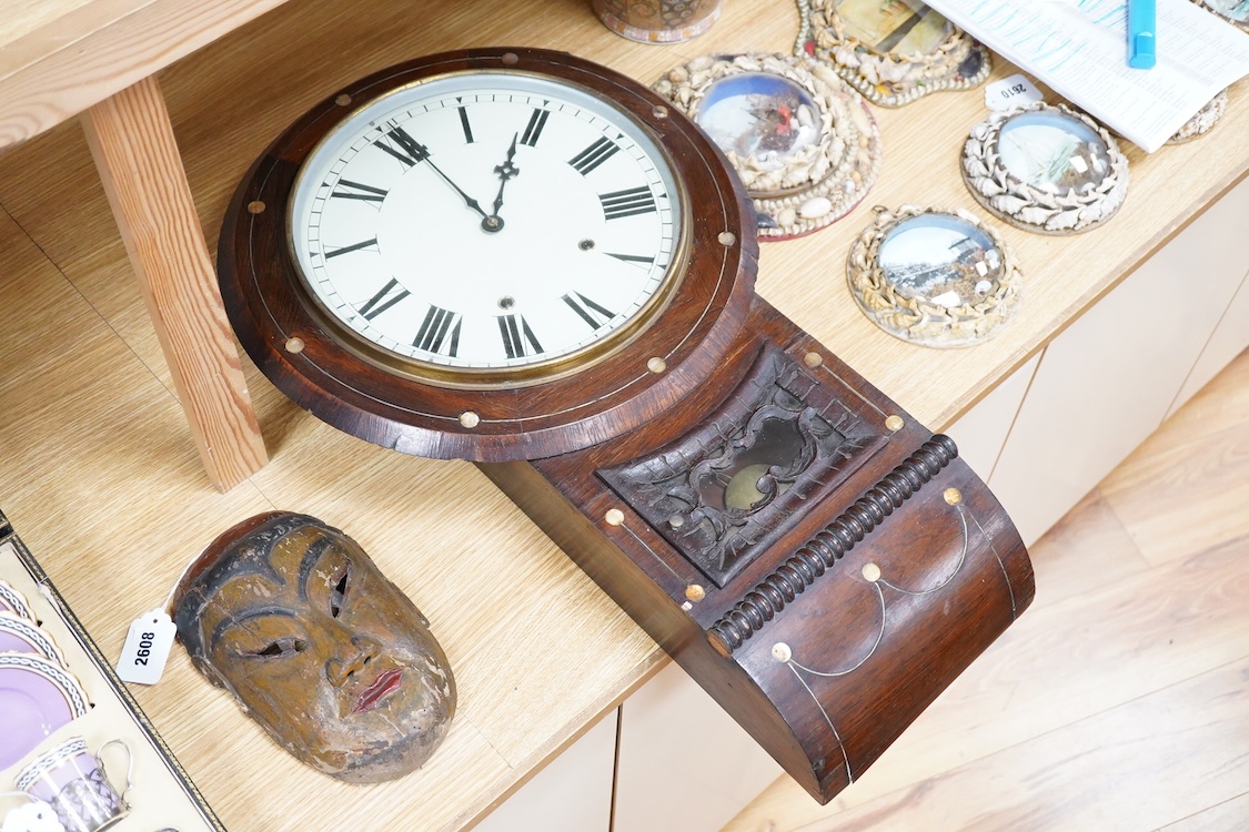 A late 19th century mahogany wall clock with mother of pearl inlaid discs, with pendulum and key, 67cm high
